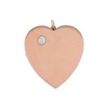 AN OPAL SET GOLD COLOURED HEART LOCKET