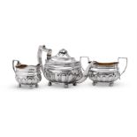 Y A GEORGE III SILVER THREE PIECE OBLONG BALUSTER TEA SET