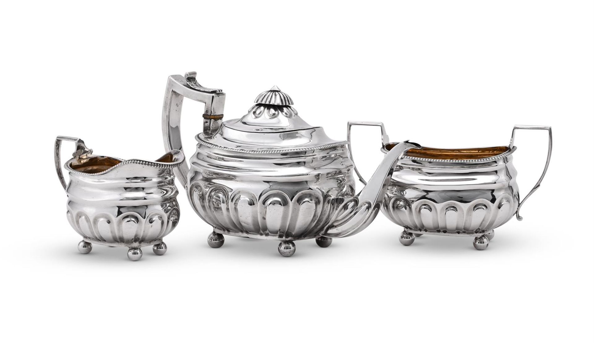 Y A GEORGE III SILVER THREE PIECE OBLONG BALUSTER TEA SET