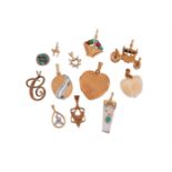 A COLLECTION OF CHARMS AND PENDANTS