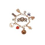 Y A MID 20TH CENTURY CHARM BRACELET AND A VICTORIAN LOVERS KNOT BROOCH