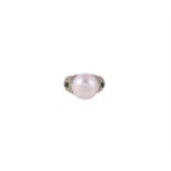 A SOUTH SEA CULTURED PEARL, DIAMOND AND EMERALD DRESS RING