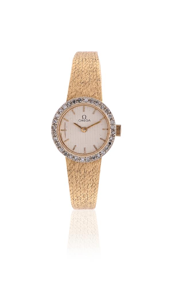 OMEGA, REF. 7244, A LADY'S 18 CARAT GOLD COLOURED AND DIAMOND BRACELET WATCH