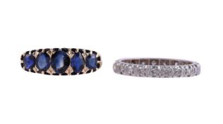 A DIAMOND ETERNITY RING AND A FIVE STONE SAPPHIRE RING