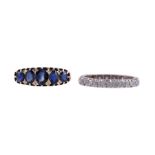 A DIAMOND ETERNITY RING AND A FIVE STONE SAPPHIRE RING