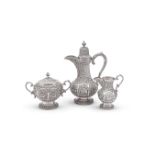 Y AN INDIAN SILVER THREE PIECE BALUSTER WATER JUG, CREAM SUGAR AND SUGAR BOWL