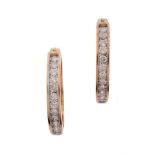 A PAIR OF DIAMOND HOOPED EARRINGS