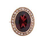 A GARNET AND DIAMOND CLUSTER RING