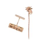 A BULL HEAD STICK PIN AND A SINGLE CUFFLINK