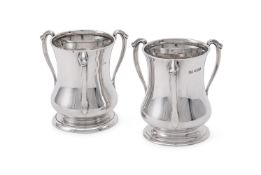 A MATCHED PAIR OF SILVER ART NOUVEAU THREE HANDLED VASES