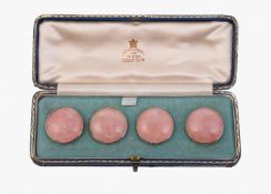 A SET OF FOUR EARLY 20TH CENTURY ROSE QUARTZ BUTTONS