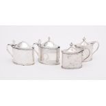 FOUR SILVER OVAL MUSTARD POTS