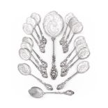 A SET OF FIFTEEN DUTCH SILVER OYSTER SPOONS AND A SERVING SPOON