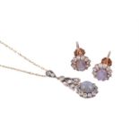 A STAR SAPPHIRE AND WHITE STONE CLUSTER PENDANT AND EARRINGS