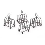 FOUR SILVER TOAST RACKS