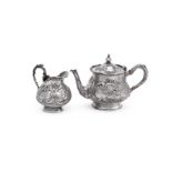 Y A GERMAN SILVER BALUSTER TEAPOT AND CREAM JUG