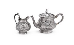 Y A GERMAN SILVER BALUSTER TEAPOT AND CREAM JUG