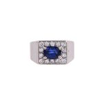 A SAPPHIRE AND DIAMOND RECTANGULAR CLUSTER RING