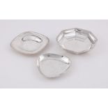 THREE SILVER COLOURED DISHES