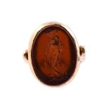 A BROWN PASTE INTAGLIO RING