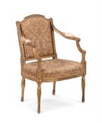 A GEORGE III CARVED GILTWOOD AND UPHOLSTERD OPEN ARMCHAIR, CIRCA 1780