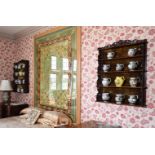 A PAIR OF VICTORIAN CARVED WALNUT HANGING WALL SHELVES, CIRCA 1860