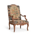 A LOUIS XV CARVED BEECH AND NEEDLEWORK UPHOLSTERED FAUTEUIL, THIRD QUARTER 18TH CENTURY