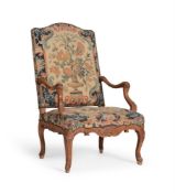 A LOUIS XV CARVED BEECH AND NEEDLEWORK UPHOLSTERED FAUTEUIL, THIRD QUARTER 18TH CENTURY