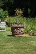 A PAIR OF LARGE TERRACOTTA URNS PLANTED WITH SMALL PALMS, MODERN