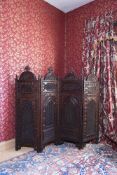 AN INDIAN CARVED HARDWOOD FOLDING ROOM SCREEN, LATE 19TH CENTURY