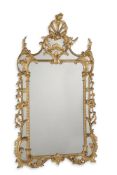 A LARGE CARVED GILTWOOD MIRROR, IN GEORGE III STYLE, 19TH CENTURY