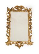 A GEORGE III CARVED GILTWOOD MIRROR, CIRCA 1760