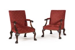 A PAIR OF CARVED WALNUT AND UPHOLSTERED GAINSBOROUGH AMRCHAIRS, LATE 19TH/EARLY 20TH CENTURY
