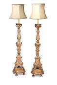 A PAIR OF ITALIAN GILTWOOD ALTAR CANDLESTICKS, 18TH CENTURY AND LATER