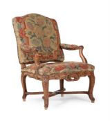 A LOUIS XV WALNUT AND NEEDLEWORK FAUTEUIL, MID 18TH CENTURY
