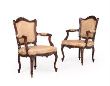 A PAIR OF GEORGE III CARVED MAHOGANY AND UPHOLSTERED ARMCHAIRS, CIRCA 1780