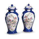 A LARGE PAIR OF BLUE GROUND FAMILLE ROSE VASES, 20TH CENTURY