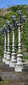 A SET OF FOUR NEOCLASSICAL STYLE LAMP POSTS, MODERN