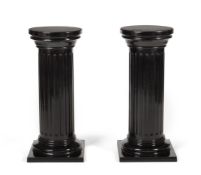 A PAIR OF EBONISED WOOD FLUTED COLUMNS, LATE 19TH/EARLY 20TH CENTURY
