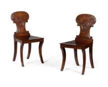 A PAIR OF GEORGE IV MAHOGANY HALL CHAIRS, CIRCA 1825