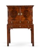 A WILLIAM AND MARY OYSTER VENEERED WALNUT CABINET, CIRCA 1690