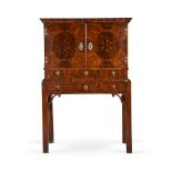 A WILLIAM AND MARY OYSTER VENEERED WALNUT CABINET, CIRCA 1690