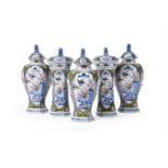 A DUTCH DELFT POLYCHROME GARNITURE OF FIVE VASES AND COVERS, LATE 17TH/18TH CENTURY