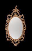 A GEORGE III CARVED GILTWOOD WALL MIRROR, CIRCA 1760