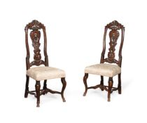 A PAIR OF DUTCH CARVED WALNUT SIDE CHAIRS, CIRCA 1740