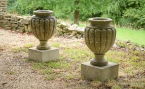 A PAIR OF CARVED LIMESTONE URNS, SECOND HALF 19TH CENTURY