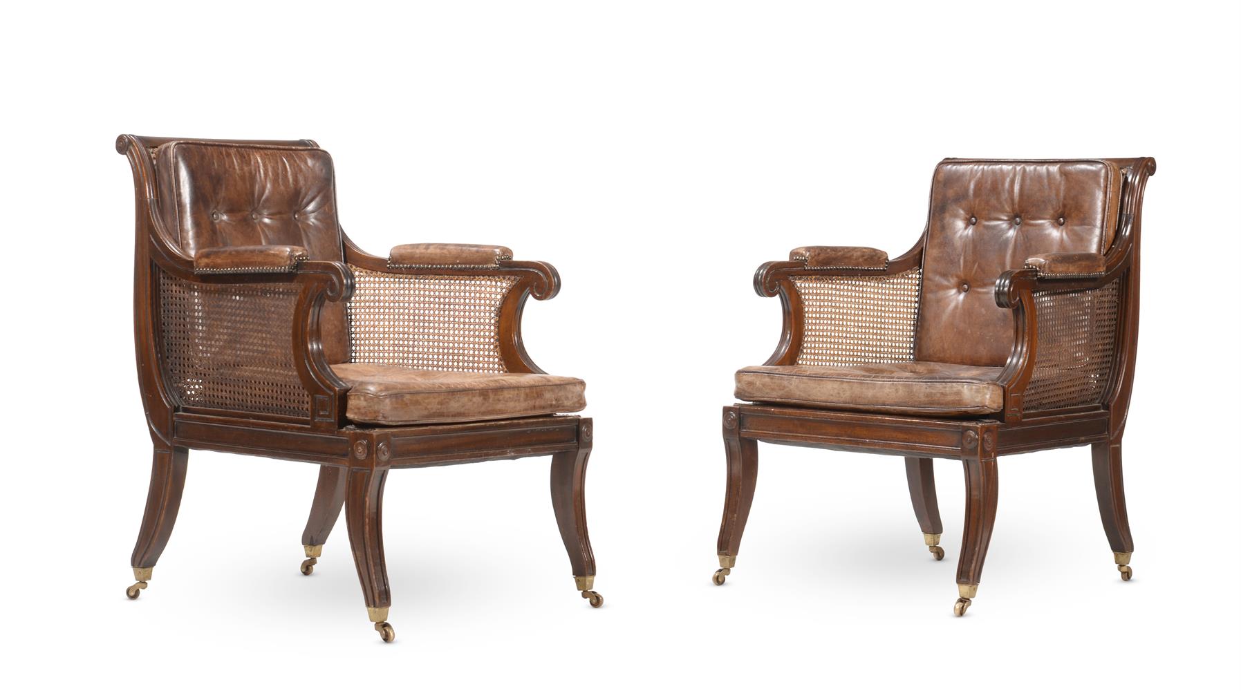 A PAIR OF MAHOGANY LIBRARY BERGERE ARMCHAIRS, IN REGENCY STYLE, 20TH CENTURY