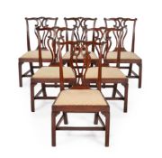 A SET OF SIX GEORGE III MAHOGANY DINING CHAIRS, IN THE MANNER OF THOMAS CHIPPENDALE, CIRCA 1770