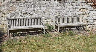A PAIR OF WEATHERED HARDWOOD GARDEN BENCHES, 20TH CENTURY