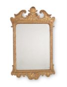 A GEORGE II GILTWOOD AND GESSO WALL MIRROR, CIRCA 1735